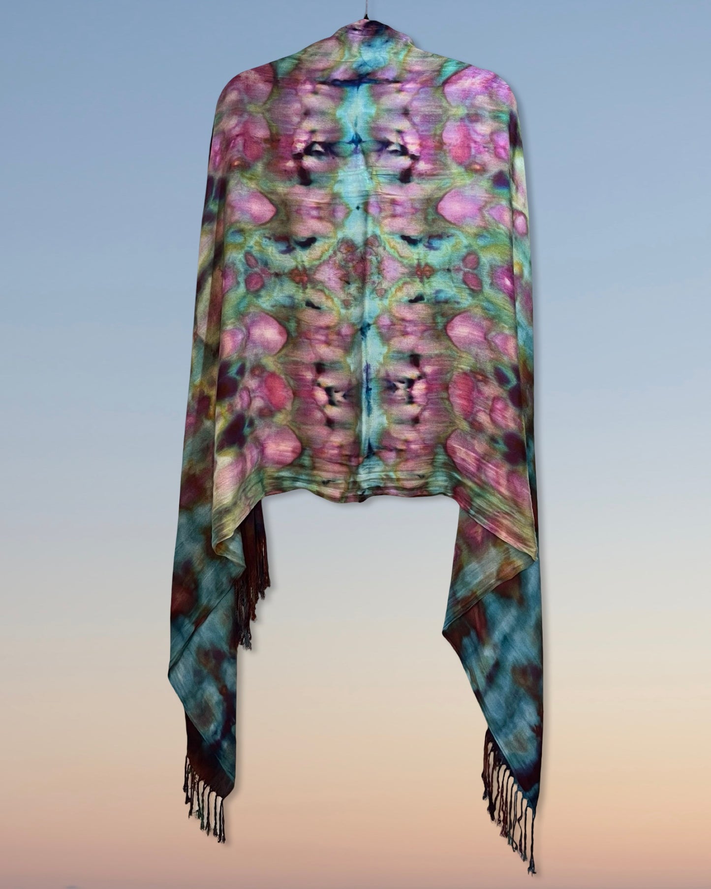Colorful scarf with floral ice dyed pattern with fringes on a gradient background