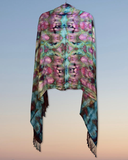 Colorful scarf with floral ice dyed pattern with fringes on a gradient background