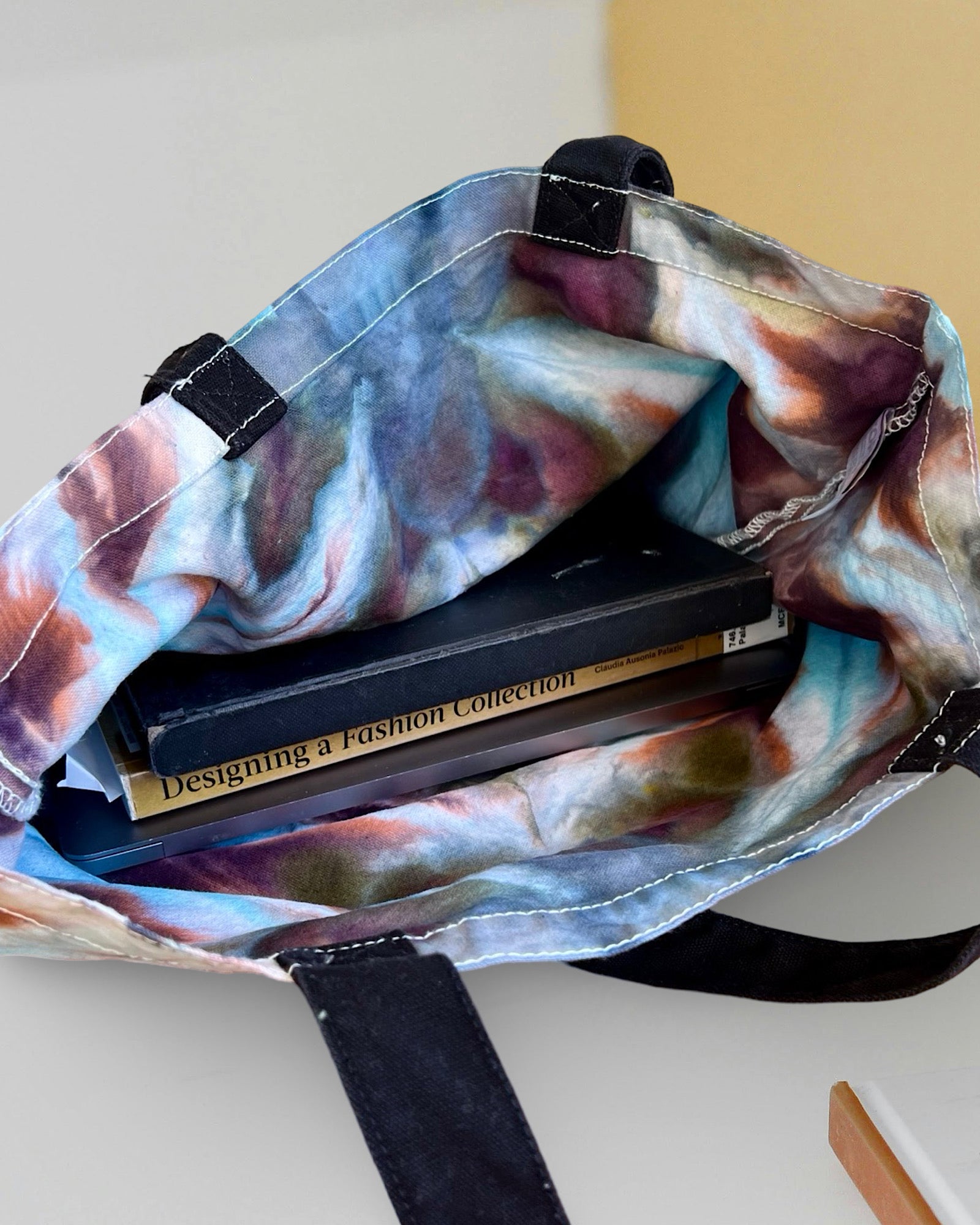 ice dye canvas tote tag peacock desk