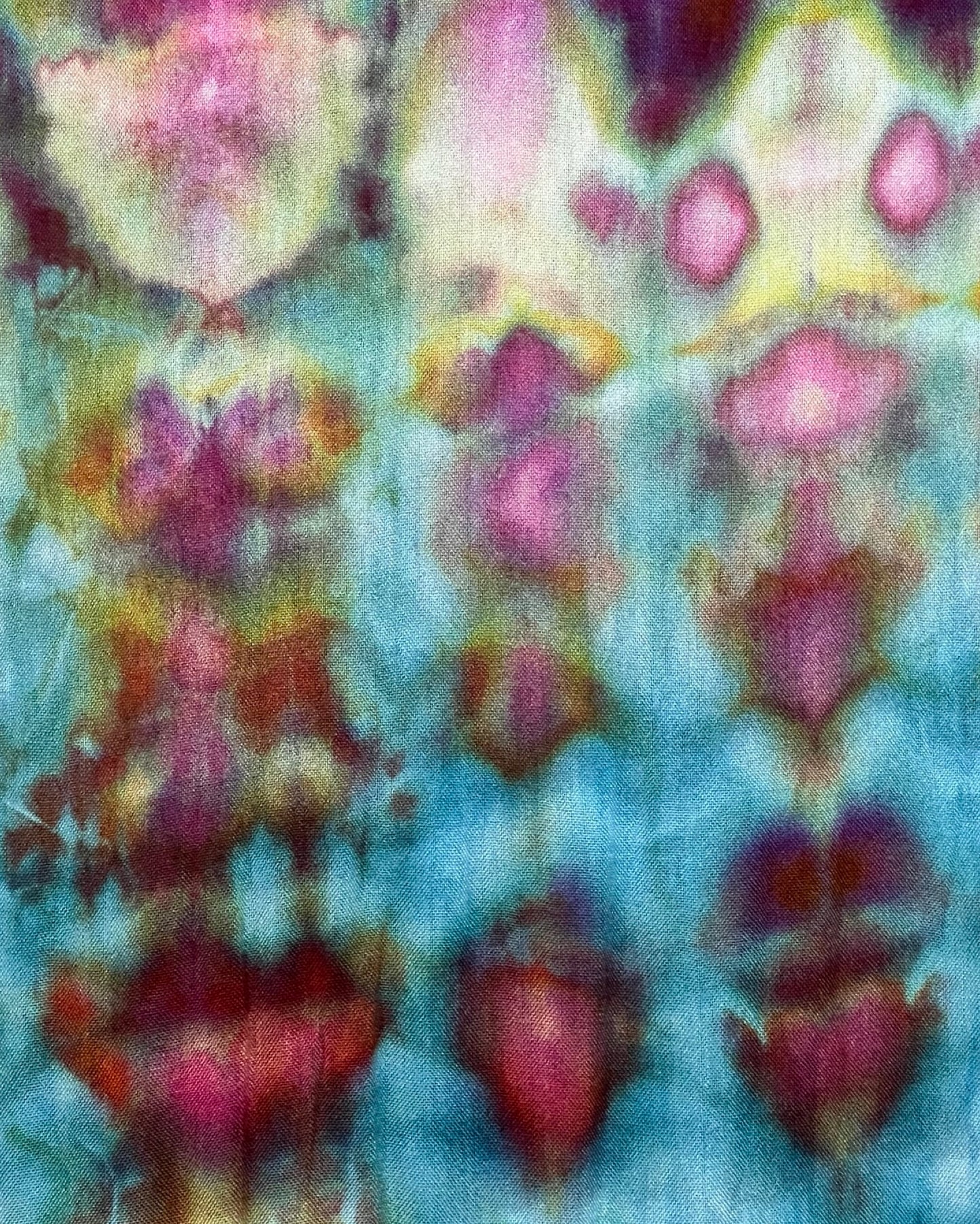 Abstract pattern with pink and yellow shapes on a blue background