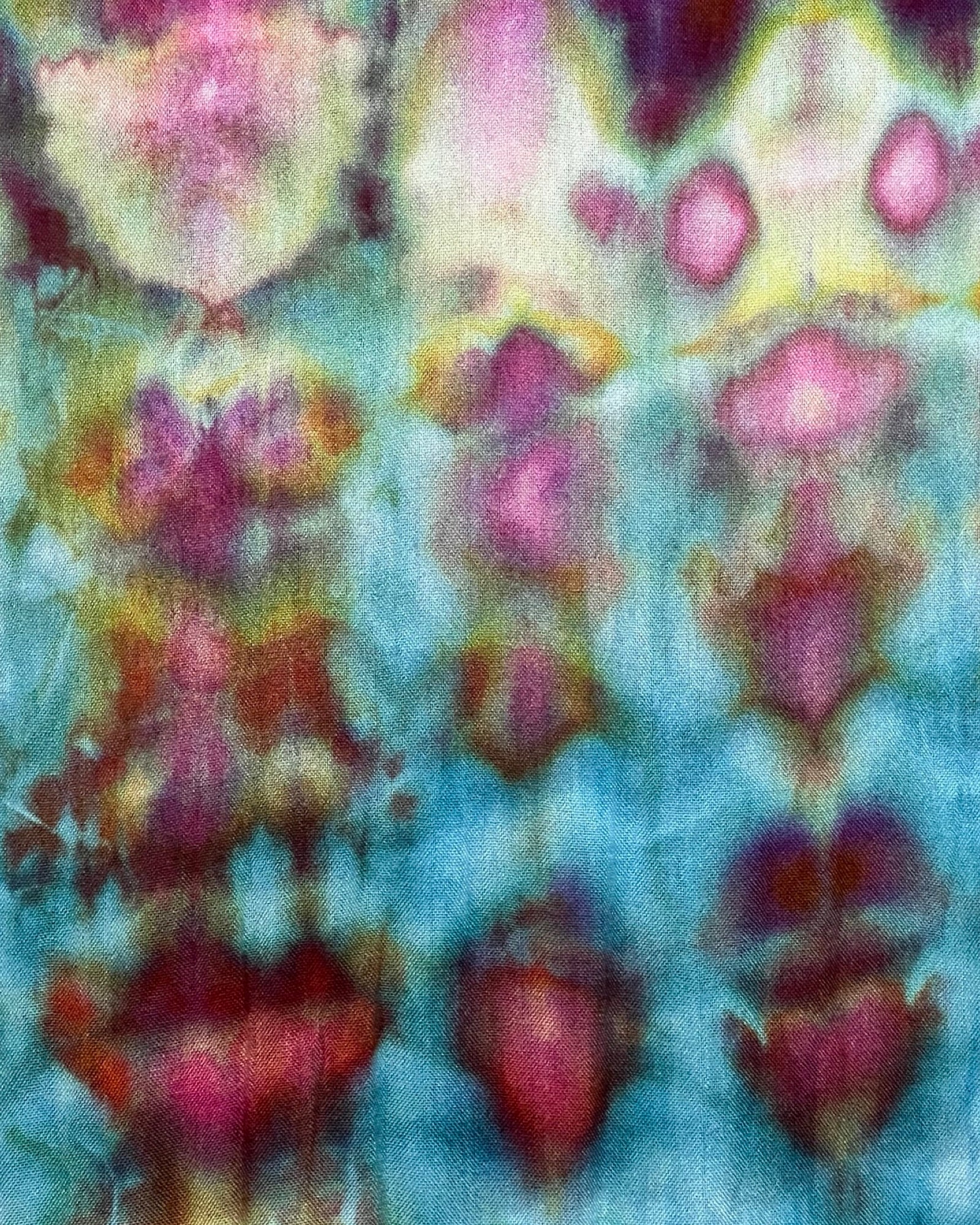 Abstract pattern with pink and yellow shapes on a blue background